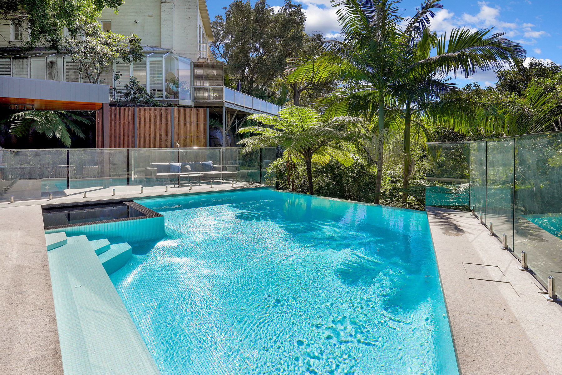 Contemporary Swimming Pool with Elegant Water Features and Ambient Lighting in Thornleigh