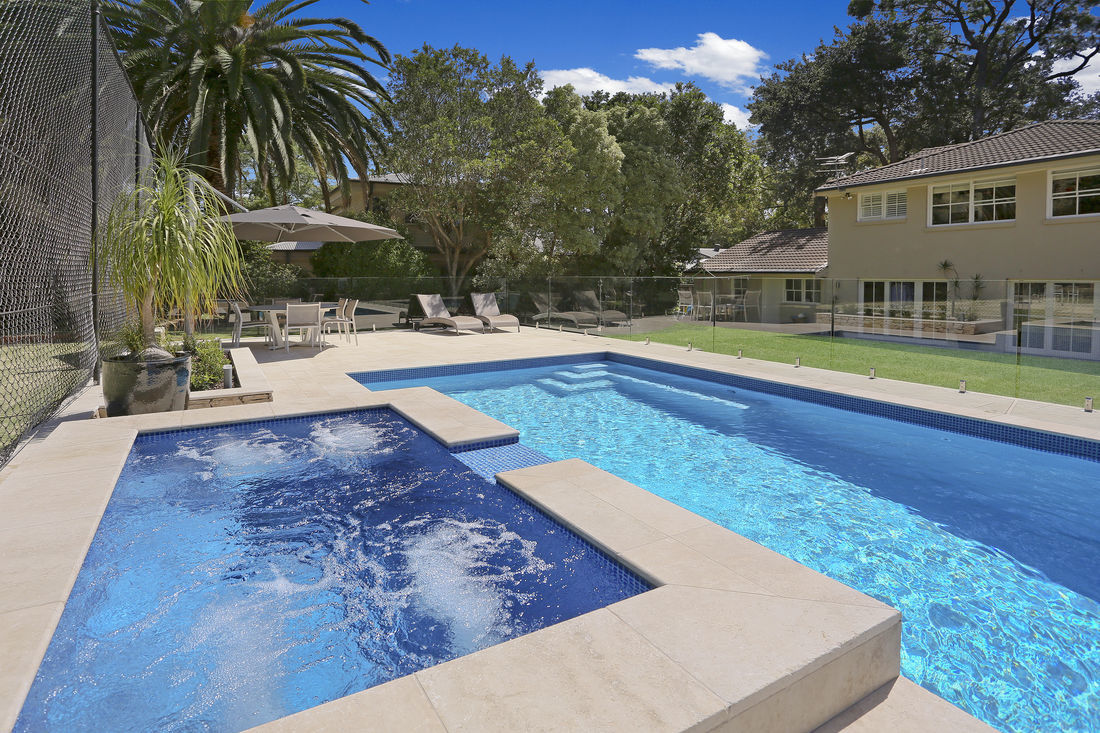 Raised spa with mid blue pool