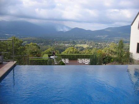 Mid blue pool infinity edge mountain views