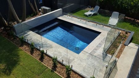 Fully tiled metallic plunge pool with feature wall