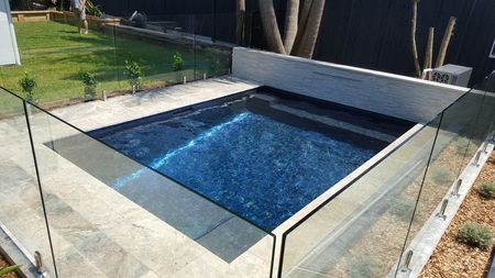 Fully tiled metallic plunge pool with feature wall
