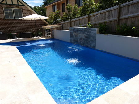 Fully tiled mid blue pool and spa with feature wall and fountains