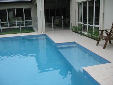 Pale blue pool with large entry ledge